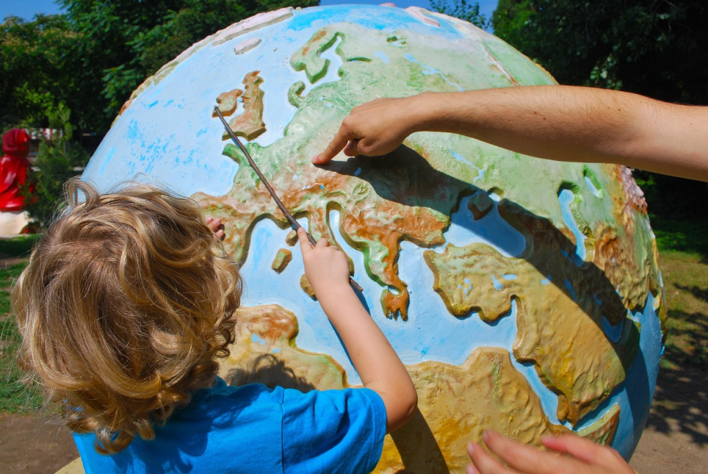 learning, geography, teaching, child, world, children learning, education, lesson, pupil, travel, europe, world map, map, outside, outdoors, germany, chech, poland, finger, pointing, stick
