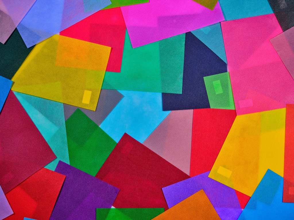 A colorful abstract image with overlapping geometric shapes creating a vibrant design.