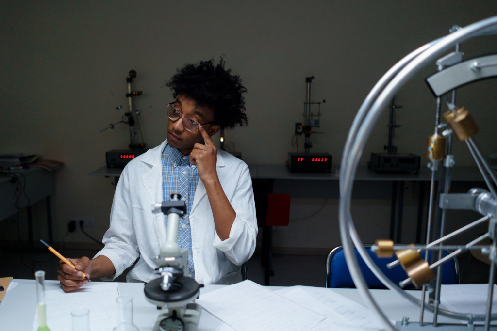 A young adult conducting scientific research in a modern laboratory setting.