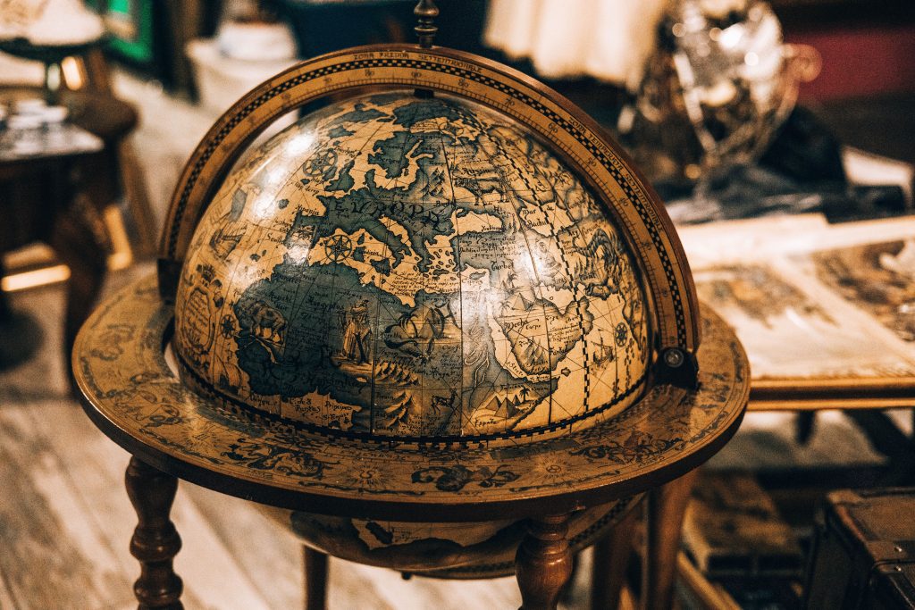 Close-up of an antique globe showcasing vintage cartography in a classic setting.